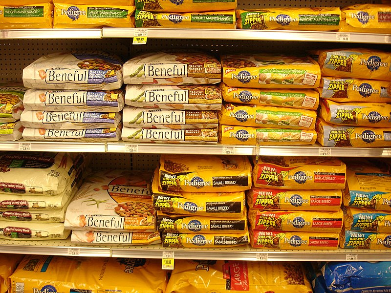 A shelf full of dog food.